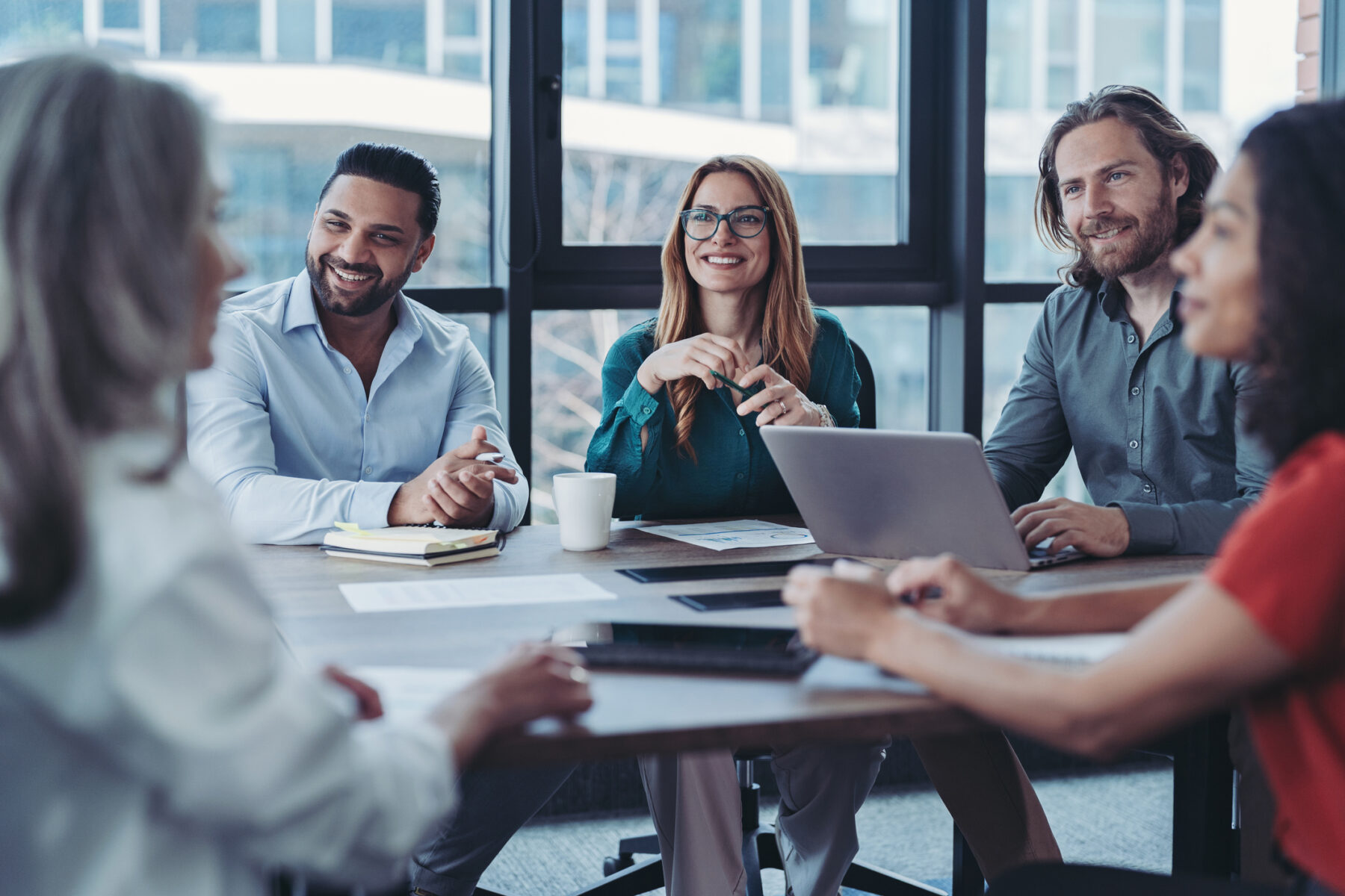 Group of business persons talking in the office