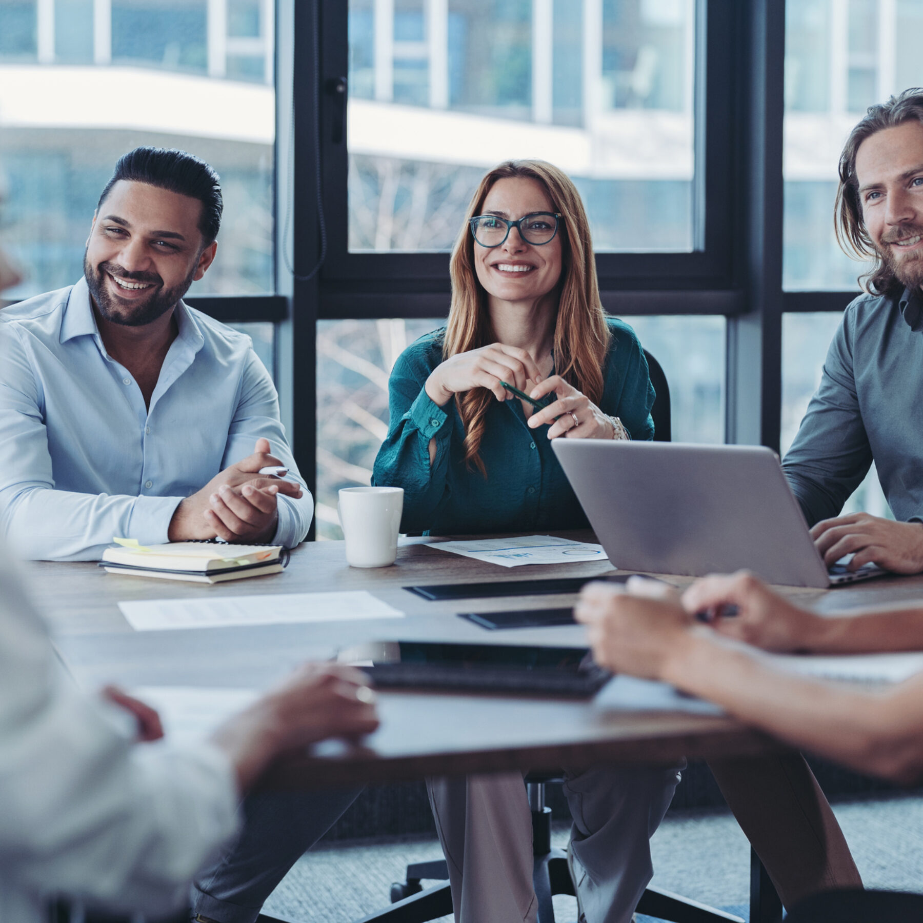 Group of business persons talking in the office