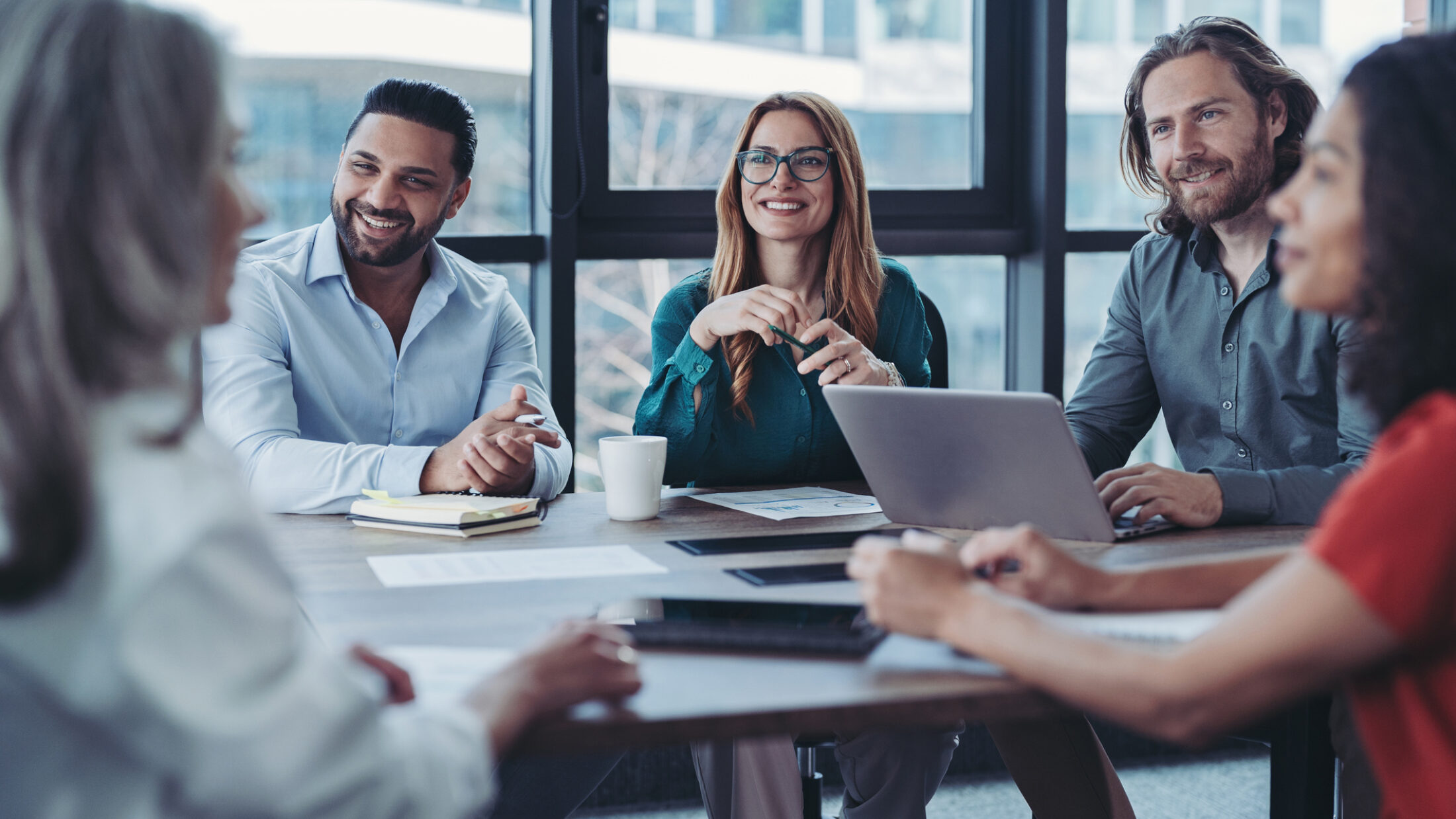 Group of business persons talking in the office